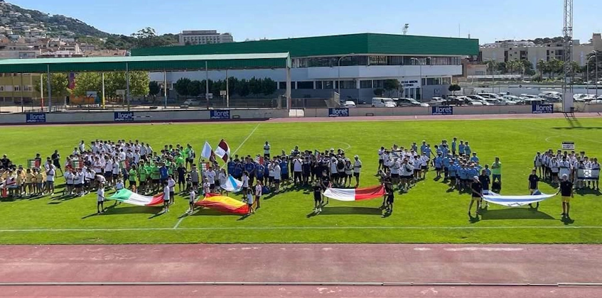 Opening of Trofeo San Jaime football tournament, teams and flags on the field