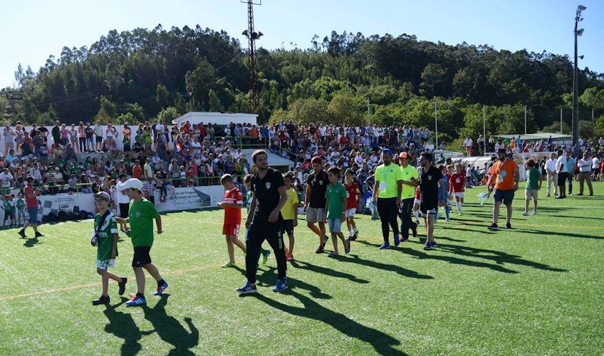 Participants of the Miranda Cup summer football tournament in front of spectators