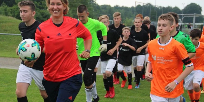 Soccer teams making their way onto the pitch at Oranje Cup event
