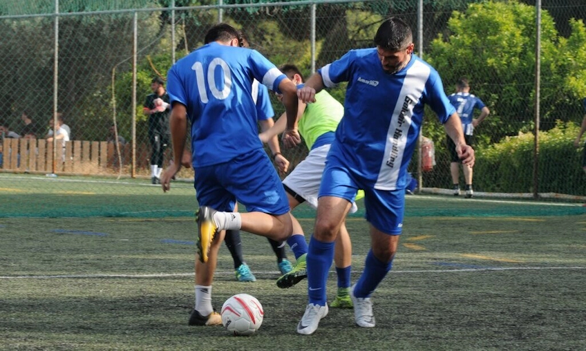 Football players in blue kits at the Soccer Challenge tournament
