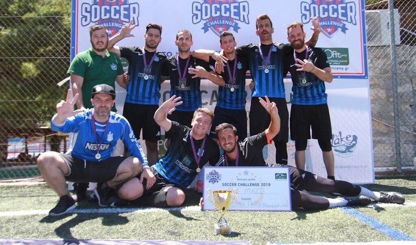 Football team with trophy at Soccer Challenge tournament